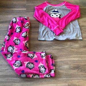 Pink and gray kids pajama set with Penguins on it.